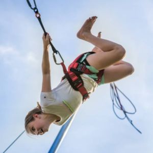 Girl on bungee trampoline